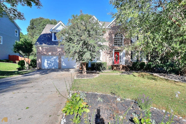 view of front of house featuring a front yard and a garage