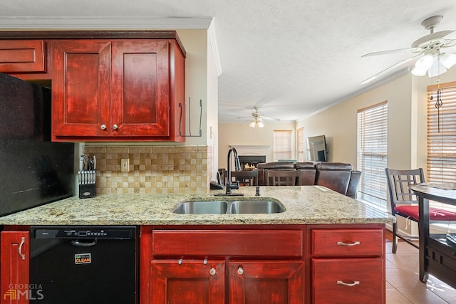 kitchen featuring ceiling fan, backsplash, sink, and black dishwasher