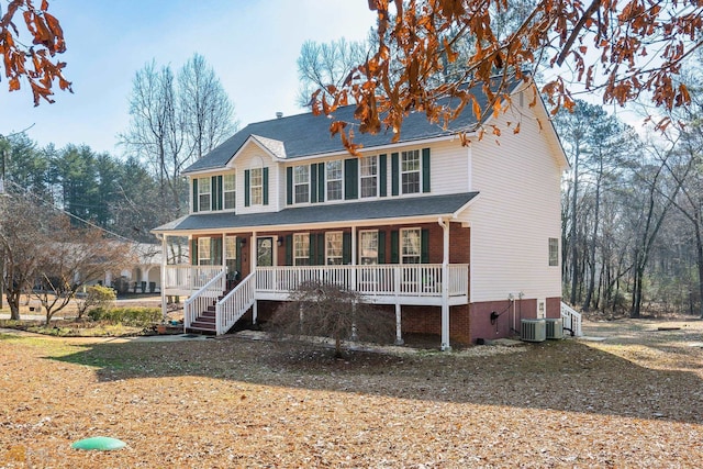 view of front of house featuring covered porch and central AC unit