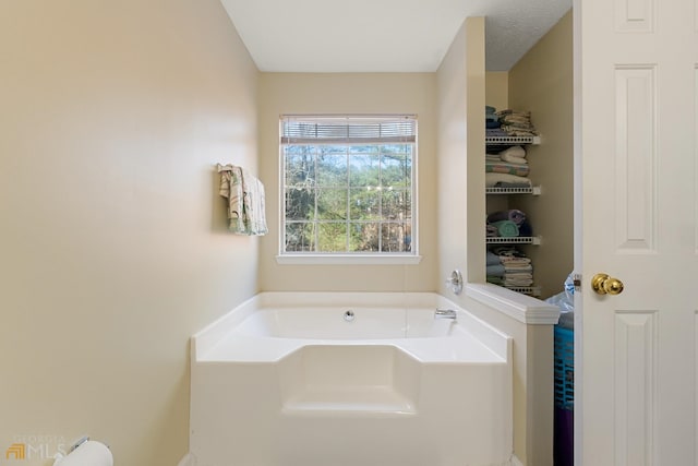 bathroom featuring a bath to relax in