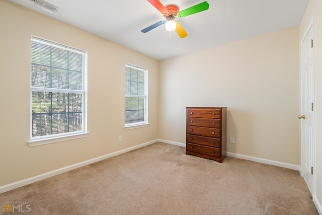 interior space featuring ceiling fan