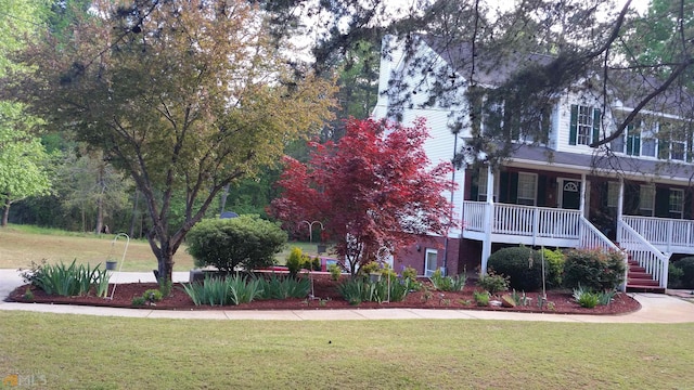 view of property's community with a yard