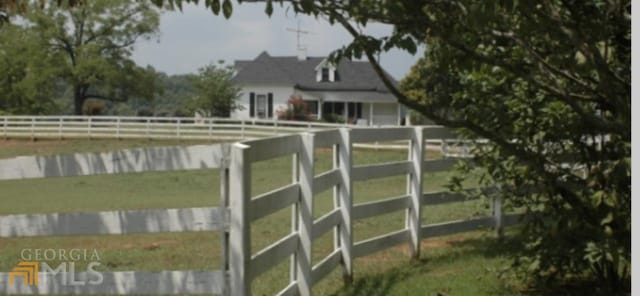 exterior space with a rural view