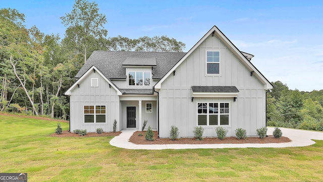 modern farmhouse with a front lawn