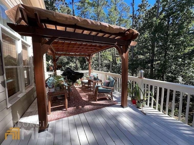 wooden terrace featuring a pergola and outdoor lounge area