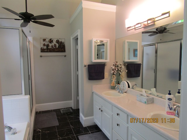 bathroom featuring oversized vanity, double sink, ceiling fan, ornamental molding, and tile flooring