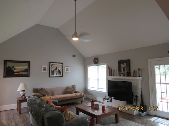 living room featuring high vaulted ceiling, ceiling fan, and hardwood / wood-style flooring