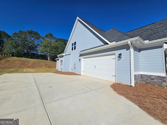 view of home's exterior with a garage