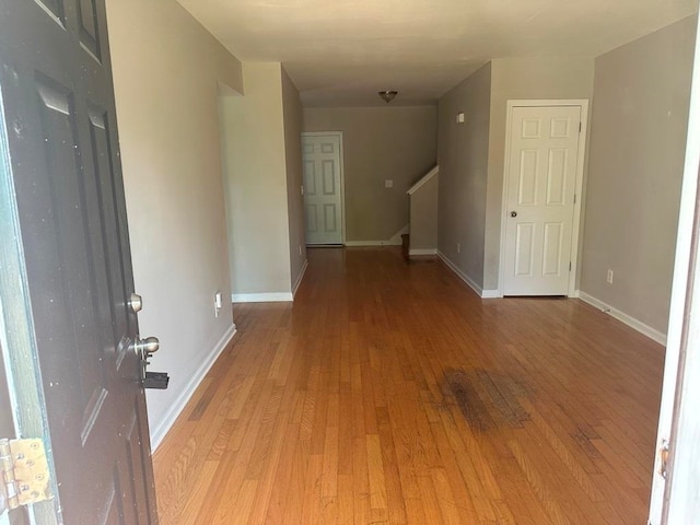 hall with light hardwood / wood-style flooring