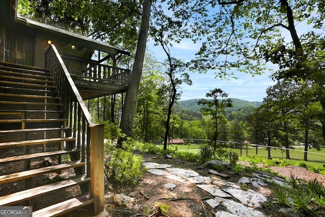 view of yard with a wooden deck