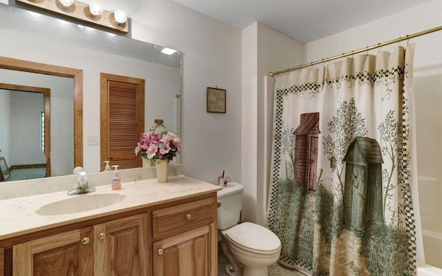 full bathroom with vanity, toilet, and shower / bath combination with curtain