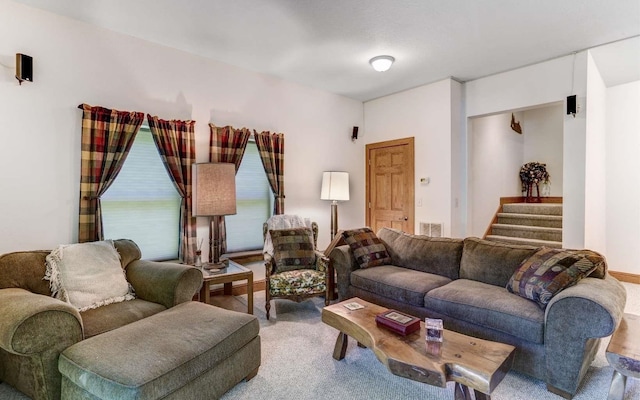 living room featuring light carpet