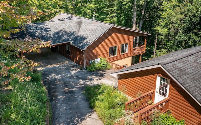 view of side of property with a balcony