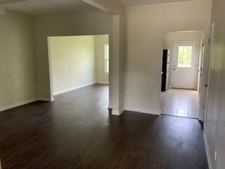 unfurnished room featuring dark hardwood / wood-style floors