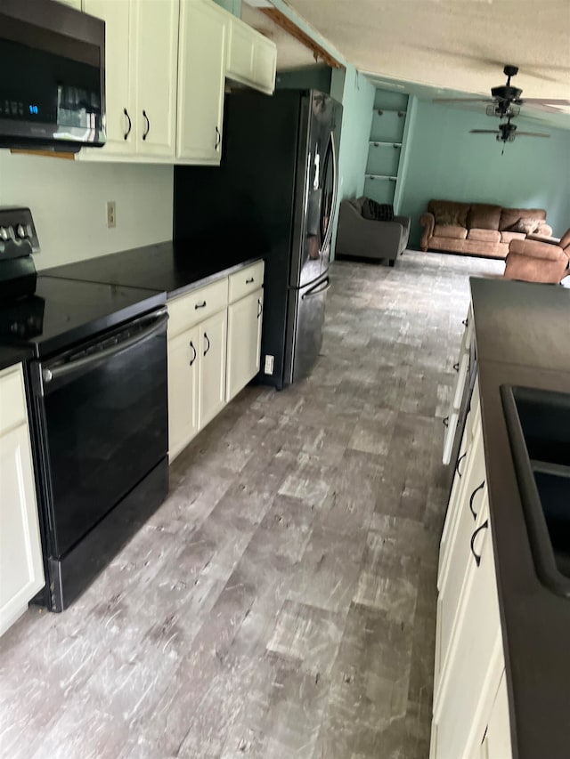 kitchen featuring ceiling fan, black appliances, and sink