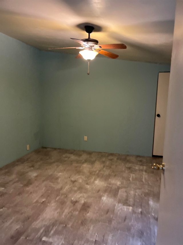 unfurnished room with ceiling fan