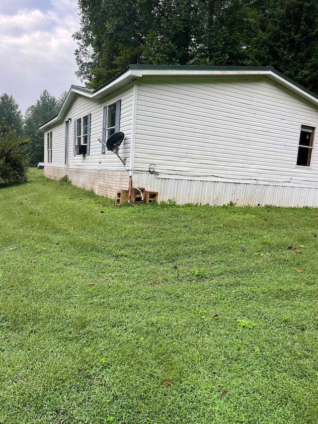 view of property exterior featuring a lawn