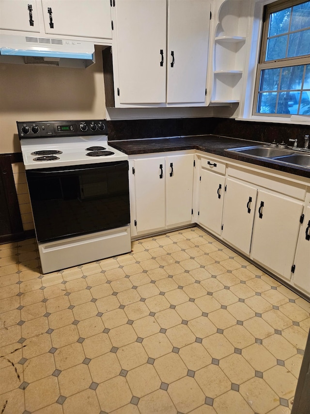 kitchen featuring white cabinets, white electric range oven, and sink