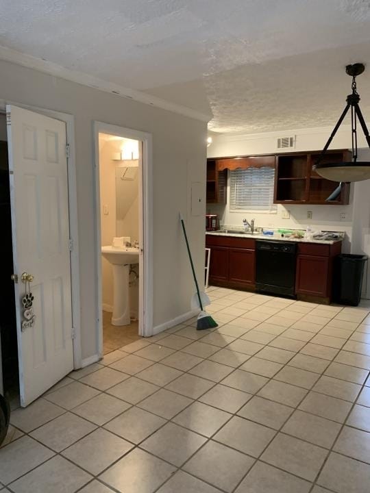 kitchen with crown molding, hanging light fixtures, light tile floors, and dishwasher