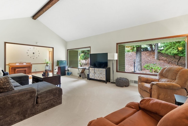 living room featuring beam ceiling, high vaulted ceiling, light colored carpet, and a healthy amount of sunlight