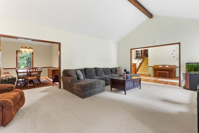 living room with high vaulted ceiling, beam ceiling, a notable chandelier, and light colored carpet