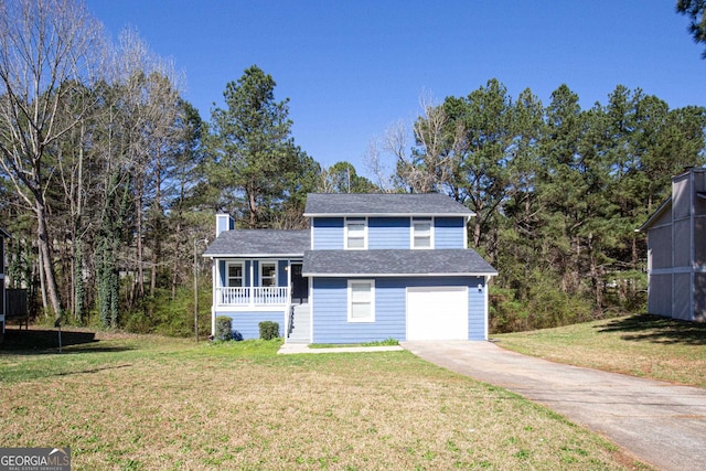 view of front facade featuring a front yard and a garage