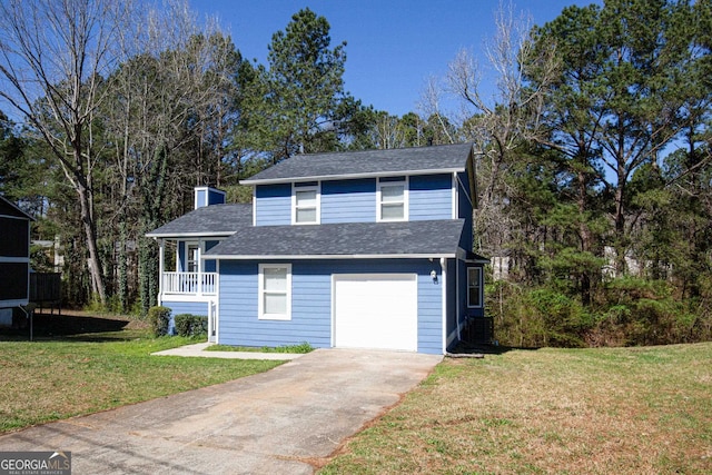 view of front property featuring a front yard and a garage