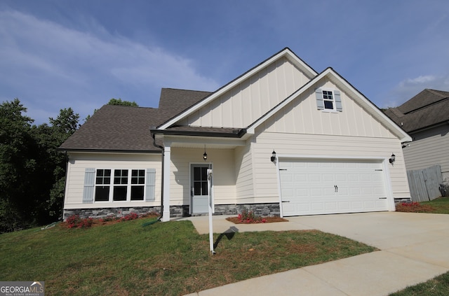 craftsman-style house with a garage and a front yard