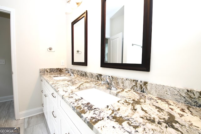 bathroom featuring tile flooring, double sink, and large vanity