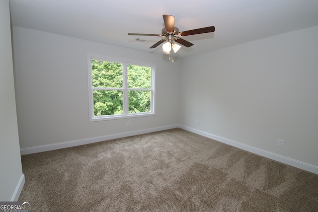 unfurnished room featuring carpet and ceiling fan