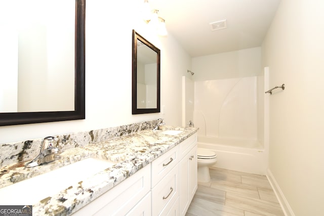 full bathroom with dual bowl vanity, toilet, tile flooring, and bathing tub / shower combination