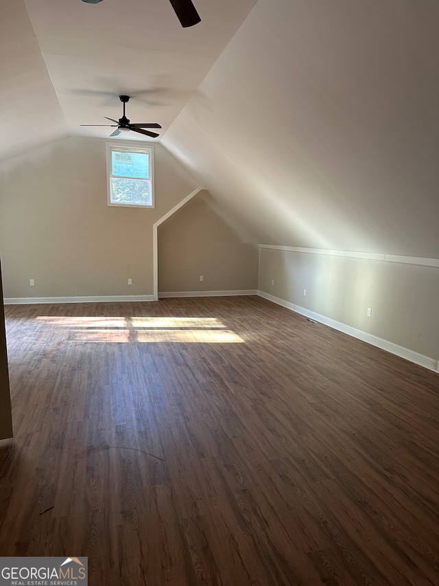 bonus room with lofted ceiling, ceiling fan, and dark hardwood / wood-style flooring