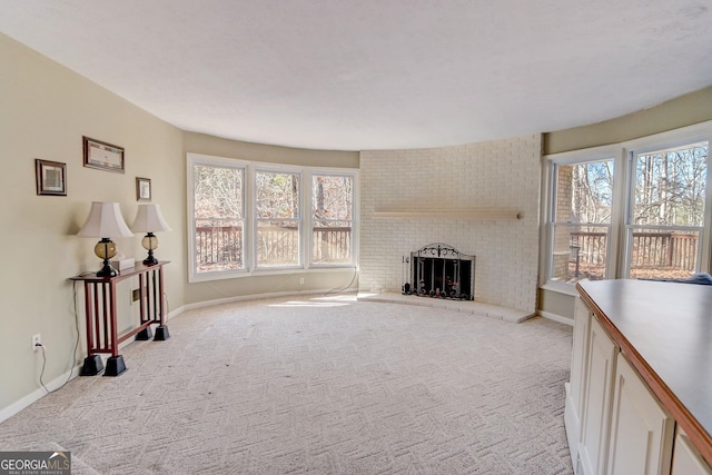 carpeted living room featuring a brick fireplace