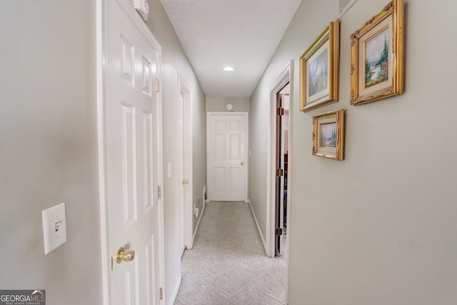 corridor with light carpet