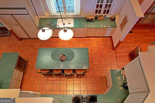 kitchen featuring white cabinets and hardwood / wood-style flooring