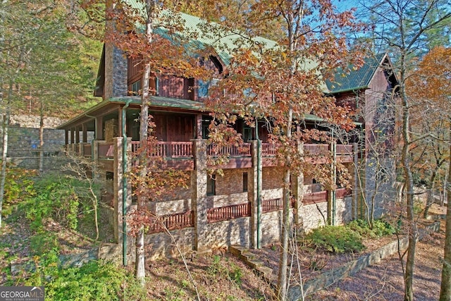 view of home's exterior featuring a balcony