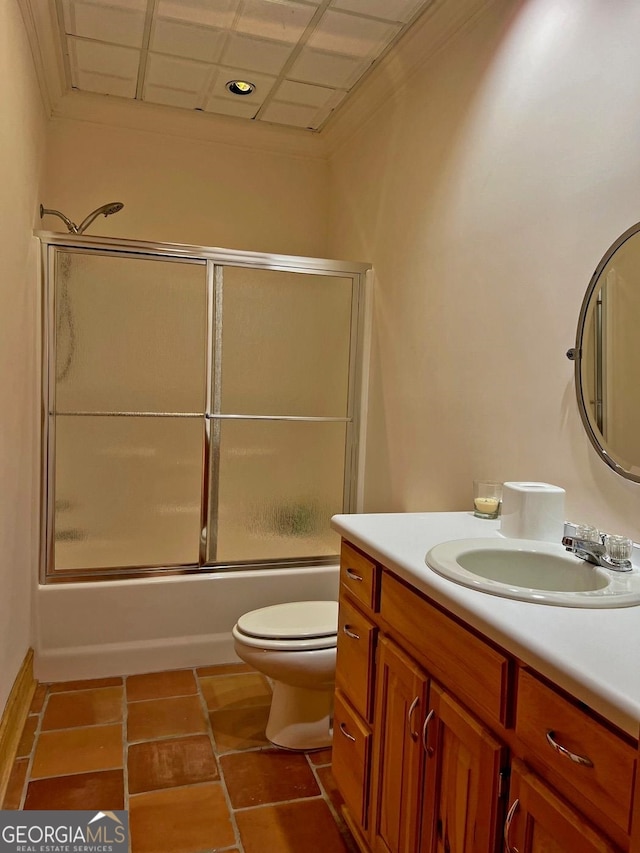 full bathroom with enclosed tub / shower combo, toilet, vanity, and tile flooring