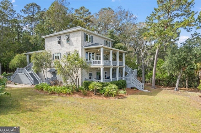 rear view of house with a lawn