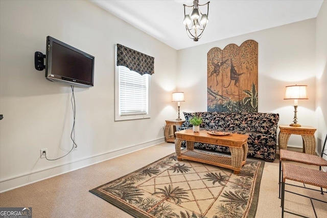 sitting room with light colored carpet and a chandelier