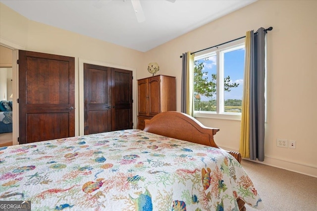 bedroom with light carpet and ceiling fan