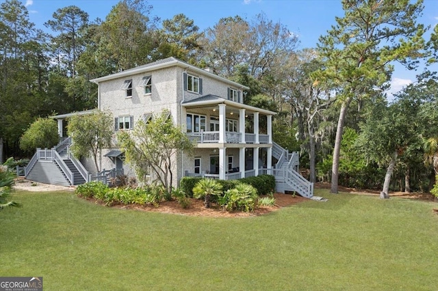 rear view of property with a yard