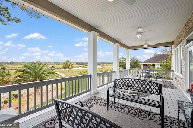 wooden terrace with ceiling fan