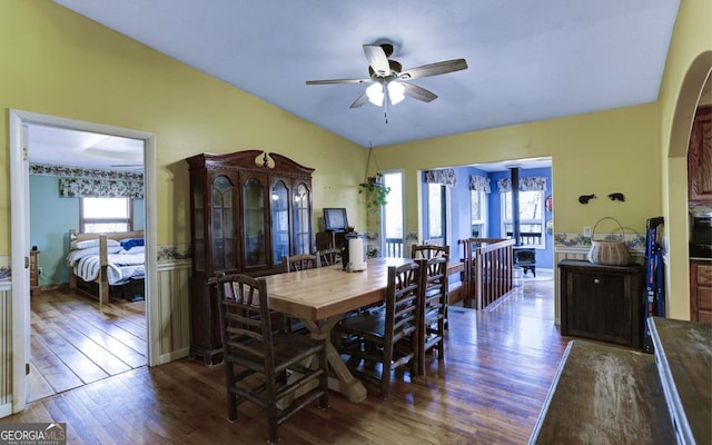 dining room featuring ceiling fan and dark wood-type flooring