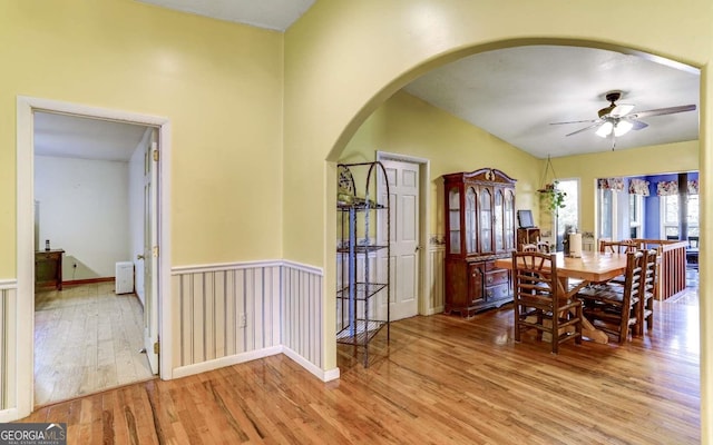 dining space with ceiling fan and light hardwood / wood-style flooring