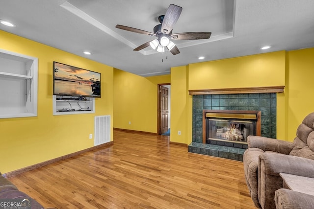 805 Quail Cove Cir, Warne, NC 28909 - living area with wood finished floors, a ceiling fan, baseboards, recessed lighting, and a fireplace