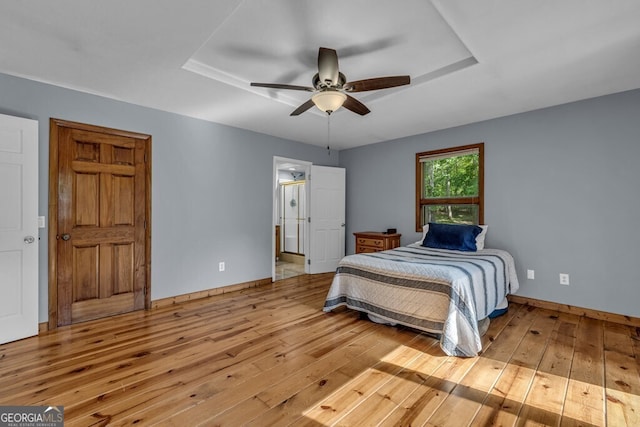 805 Quail Cove Cir, Warne, NC 28909 - bedroom with wood-type flooring, baseboards, ceiling fan, and ensuite bath