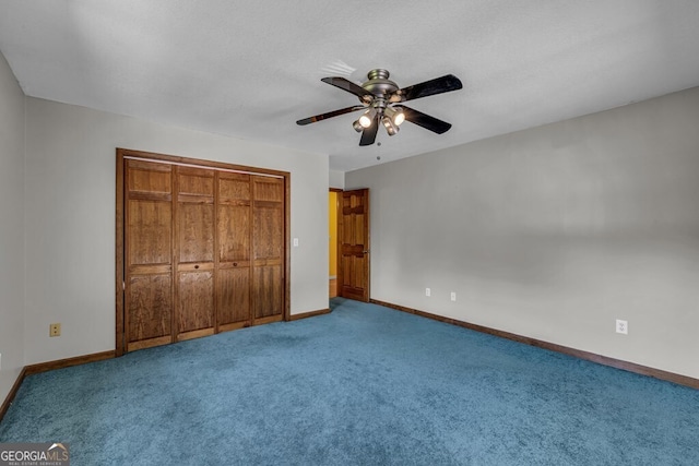 805 Quail Cove Cir, Warne, NC 28909 - unfurnished bedroom with carpet floors, baseboards, a closet, and ceiling fan