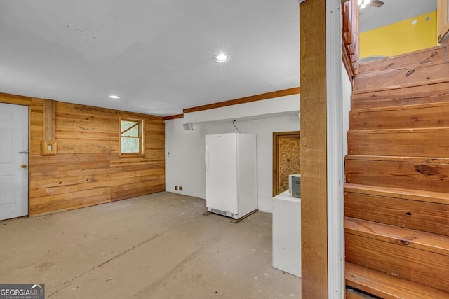 805 Quail Cove Cir, Warne, NC 28909 - basement with freestanding refrigerator, wood walls, and recessed lighting