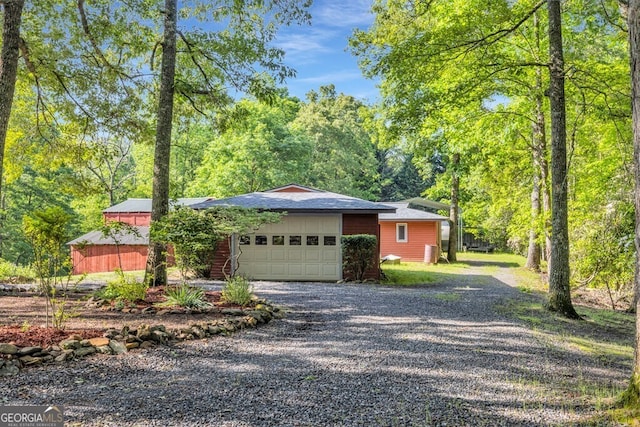805 Quail Cove Cir, Warne, NC 28909 - view of front facade featuring driveway and a garage