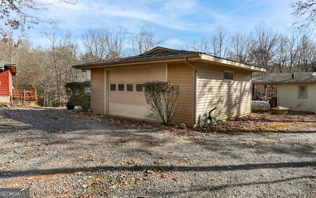 805 Quail Cove Cir, Warne, NC 28909 - detached garage with gravel driveway